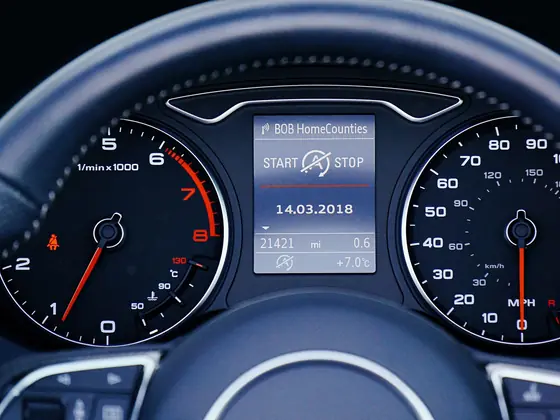 Close view of a car dashboard with round instrument dials
