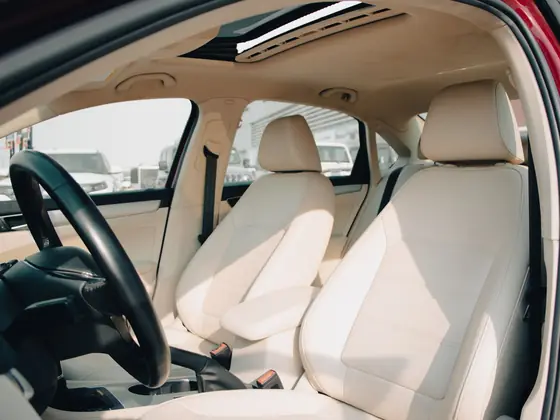 Interior view of a vehicle showing seats and cabin trim