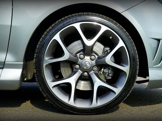 Close view of a silver alloy wheel and tyre