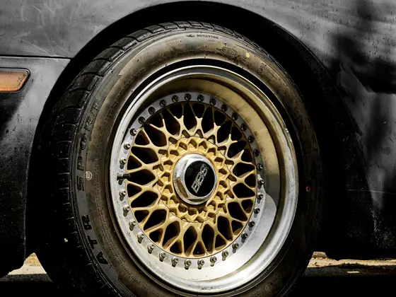 Detail of a road wheel with visible rim and tyre